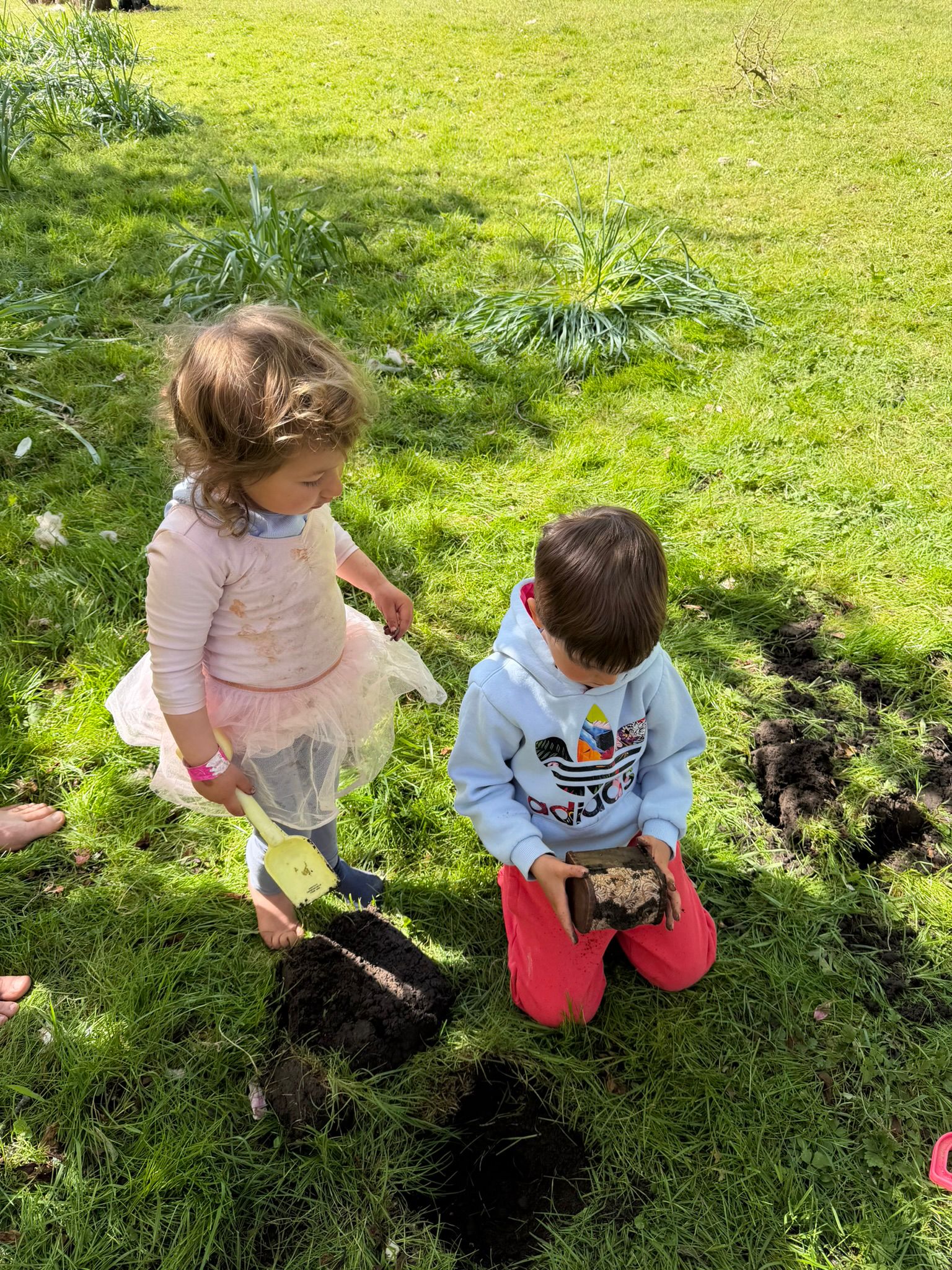 Children holding a find during the dig